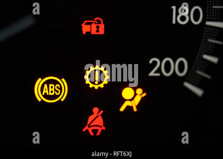 Alert car signs and icons light on dashboard close up Stock Photo