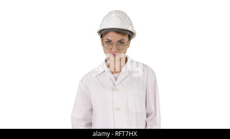 Medium shot. Young woman engineer in hard hat walking on white background. Professional shot in 4K resolution. 006. You can use it e.g. in your commer Stock Photo