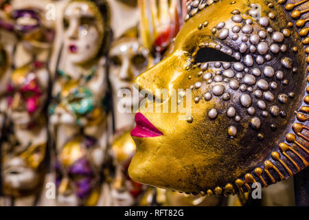 Artful and colorful masks for the Carnival of Venice, Carnevale di Venezia, are displayed in a shop for sale Stock Photo