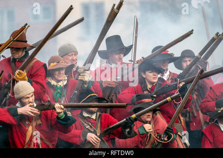 Nantwich, Cheshire, UK 26th Jan, 2019 . The Battle of Nantwich. For more than 40 years, the faithful troops of The Sealed Knot have gathered in the historic town of Nantwich, Cheshire, to re-enact the bloody shooting battle, muskets firing guns gun soldiers soldier, that took place in 1644. Now known as Holly Holy Day, the annual event re-enacts the battle that ended the long and painful siege of the town. Credit: MWI/AlamyLiveNews. Stock Photo