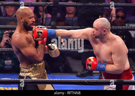 Brooklyn, New York, USA. 26th Jan, 2019. ADAM KOWNACKI (white and red trunks) battles GERALD WASHINGTON in a heavyweight bout at the Barclays Center in Brooklyn, New York. Credit: Joel Plummer/ZUMA Wire/Alamy Live News Stock Photo