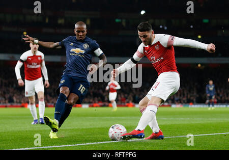 London, UK. 25th Jan, 2019. Manchester United's Ashley Young (2nd L) vies with Arsenal's Sead Kolasinac (1st R) during the FA Cup fourth round match between Arsenal and Manchester United at the Emirates Stadium in London, Britain on Jan. 25, 2019. Manchester United won 3-1. Credit: Han Yan/Xinhua/Alamy Live News Stock Photo