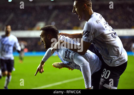 Everton's Cenk Tosun (left) celebrates scoring his side's second goal of the game with team-mate Richarlison during the FA Cup fourth round match at The Den, London. Stock Photo