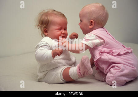 two babies fighting