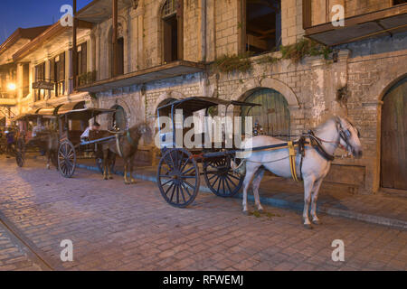 Kalesa horse carriages on historic Calle Crisologo, Vigan, Ilocos Sur, Philippines Stock Photo