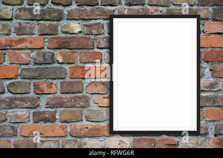 empty picture frame  mock-up  and copy space onbrick stone wall background Stock Photo