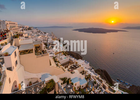 View of white washed houses and Mediterranean sea at sunset, Fira, Firostefani, Santorini (Thira), Cyclades Islands, Greek Islands, Greece, Europe Stock Photo