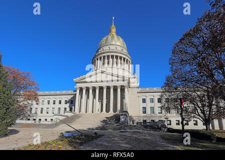 Front entrance and dome of the West Virginia capitol building along the Kanawha River in Charleston against a blight blue autumn sky Stock Photo