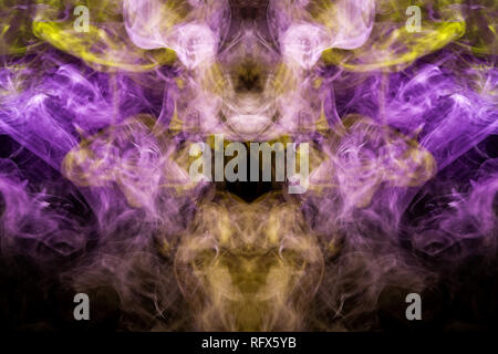 Mocap for cool t-shirts. Thick colorful yellow and purple smoke  in the form of a monster on a black isolated background. Background from the smoke of Stock Photo