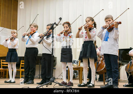 Kiev, Ukraine. January 21 2019 Children's violin ensemble. Children with violins on stage. Children's initiative, small talents. Early child developme Stock Photo