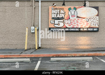 A logo sign outside of a Little Caesars restaurant location in Chambersburg, Pennsylvania on January 25, 2019. Stock Photo