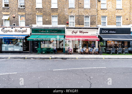 London, UK - September 12, 2018: Neighborhood of Pimlico Street with empty road and vintage old stores shops cafe restaurants with nobody Stock Photo