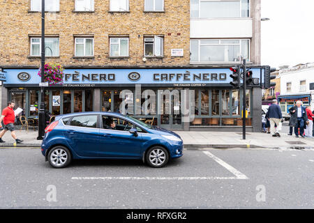 London, UK - September 12, 2018: Neighborhood of Pimlico Street with road and cafe Nero restaurant with people and car