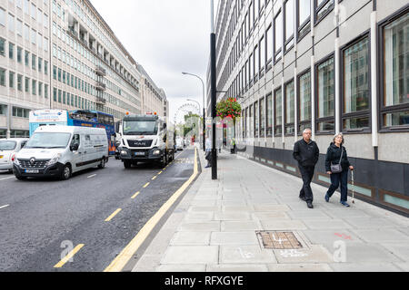 London, UK - September 12, 2018: Neighborhood of Westminster on Victoria street with people pedestrians walking on sidewalk and cars traffic on road Stock Photo