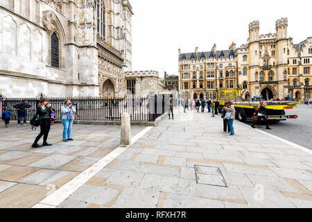 London, UK - September 12, 2018: Westminster Abbey with people and sidewalk by attorney general's office during day Stock Photo