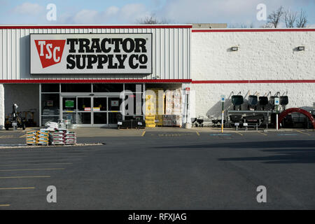 A logo sign outside of a Tractor Supply Company retail store