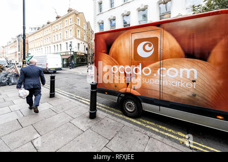 London, UK - September 12, 2018: Ocado online store grocery shopping delivery supermarket sign on truck with red orange color in Covent Garden near So Stock Photo