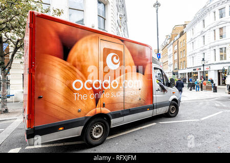 London, UK - September 12, 2018: Ocado online store grocery shopping delivery supermarket sign on truck closeup in Covent Garden near SoHo with red or Stock Photo