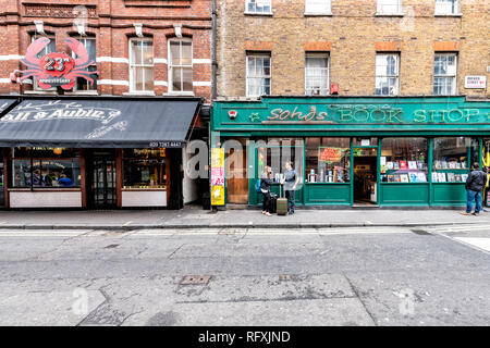 London, UK - September 12, 2018: Brewer street road in SoHo downtown city and retro vintage stores such as Book Shop and Lobster restaurant Stock Photo