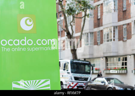 London, UK - September 16, 2018: Ocado online store grocery shopping delivery supermarket green sign on truck closeup in South Kensington Stock Photo