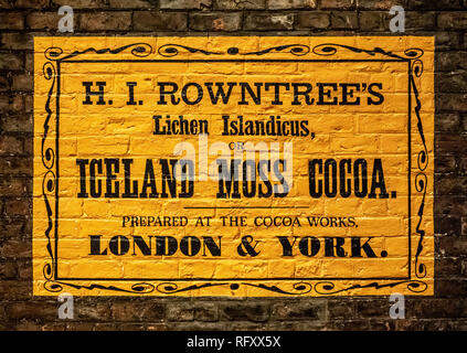 Exhibit at Castle Museum, York, UK.  Kirkgate Victorian street. Rowntree's Iceland Moss Cocoa sign on wall Stock Photo