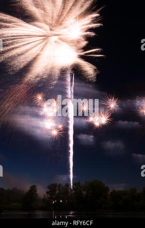 Assorted colored fireworks over the Illinois River on 4th of July.  Ottawa, Illinois, USA Stock Photo