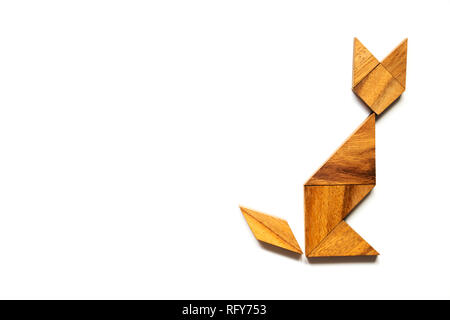 Wood tangram puzzle in cat sitting shape on white background Stock Photo