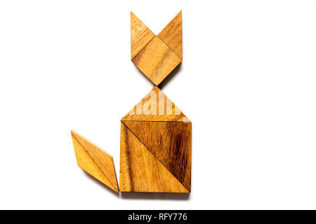 Wood tangram puzzle in cat sitting shape on white background Stock Photo