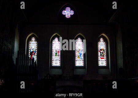 Stained glass windows in the 1860s Chapel designed by William Butterfield for Bishop Tait at the Bishops' Palace, Fulham, London Stock Photo