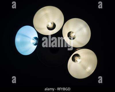 Abstract background with blue and white lamps or lights isolated from black background. Stock Photo