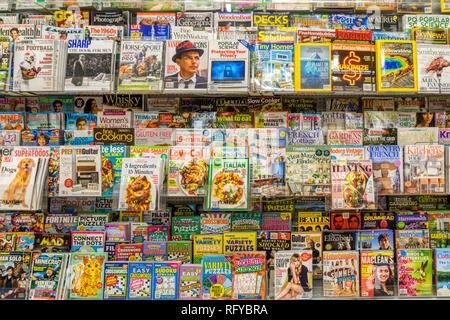 A rack of magazines for sale in a supermarket. Stock Photo