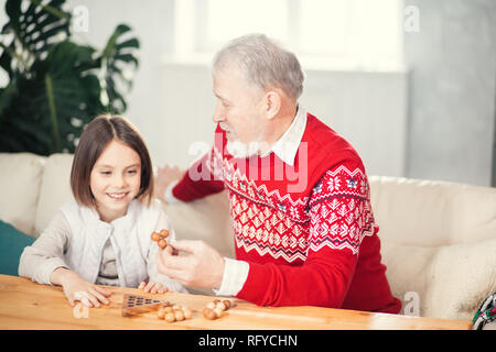 Grandpa and granddaughter are spending good time together Stock Photo