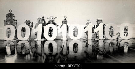 retro robots holding up 0 and 1,s binary code numbers on a old woooden floor solarized monochrome Stock Photo