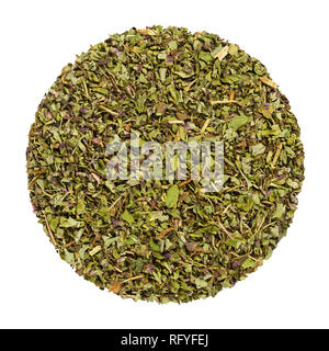 Dried oregano, herb circle from above, isolated, over white. Disc made of Origanum vulgare, sometimes wild marjoram. Herb. Stock Photo