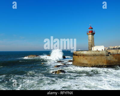 Waves hitting Felgueiras Lighthouse in Porto - Portugal Stock Photo