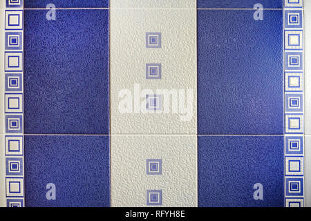 The design of the wall is made of tile for the bathroom. Natural texture. Colored stone structure. Stock Photo