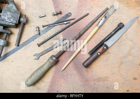 old working tools on painted wooden rustic background. Stock Photo