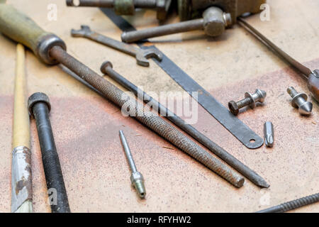 old working tools on painted wooden rustic background, select focus. Stock Photo