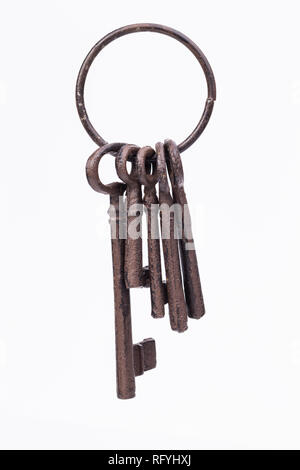 Image shows an old, rustic key ring, isolated on white Stock Photo