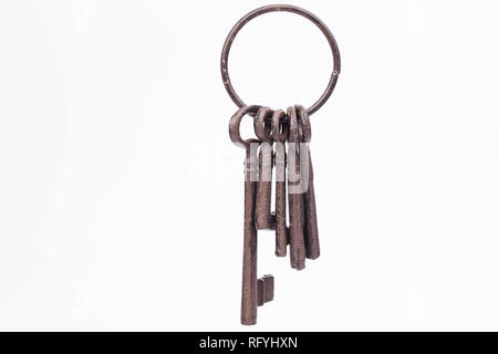 Image shows an old, rustic key ring, isolated on white Stock Photo