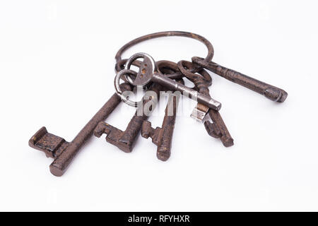 Image shows an old, rustic key ring, isolated on white Stock Photo