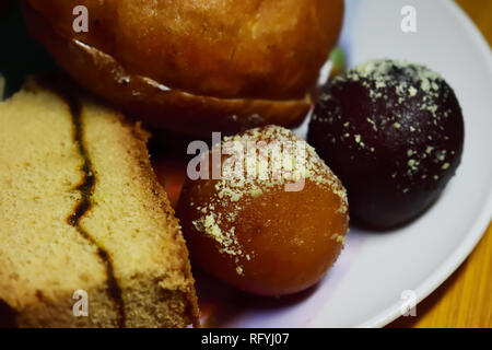 Cake and Sweets served on a plate Stock Photo