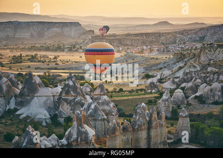 Ballons and uniqe rocks of Cappadocia. An ordinary morning in Cappadoica Stock Photo