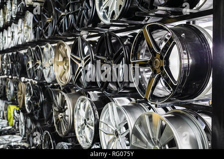 wall of alloy car wheels in store Stock Photo
