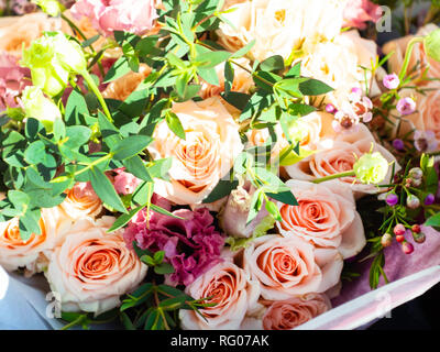 Wedding bouquet of roses and peas. Bridal bouquet on wedding day. Different flowers of pink, violet Stock Photo
