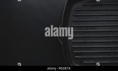 Cast iron griddle pan on black background Stock Photo