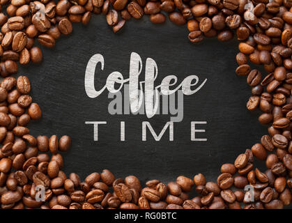 coffee time concept. retro text written inside roasted coffee beans frame. Stock Photo