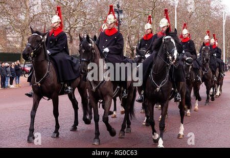 London, England - January 23, 2019. Members of the Queens Life Guards ride along The Mall following their daily changing of the guard ceremonies at th Stock Photo