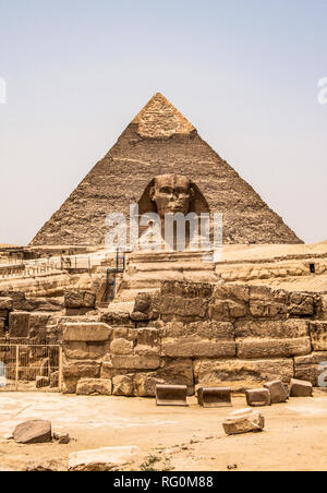 Egyptian Great Sphinx full body portrait head,with pyramids of Giza background Egypt empty with nobody copy space Stock Photo