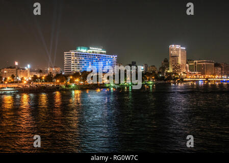 Cairo, Egypt - 25.05.2018 Cairo skyline showing the Nile Ritz Carlton Hotel illuminated at Night Stock Photo